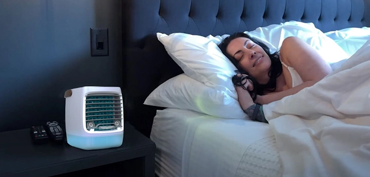 woman sleeping with ChillWell 2.0 beside her bed